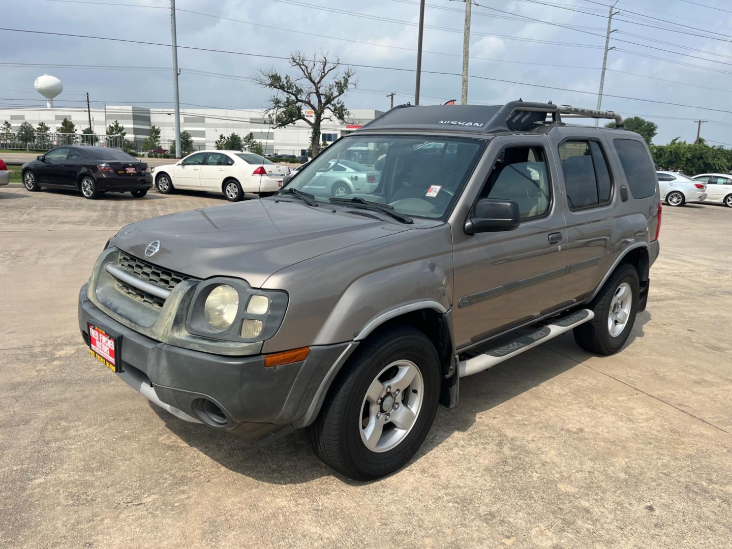 2004 GOLD /gray Nissan Xterra (5N1ED28T84C) , Automatic transmission, located at 14700 Tomball Parkway 249, Houston, TX, 77086, (281) 444-2200, 29.928619, -95.504074 - Photo#2